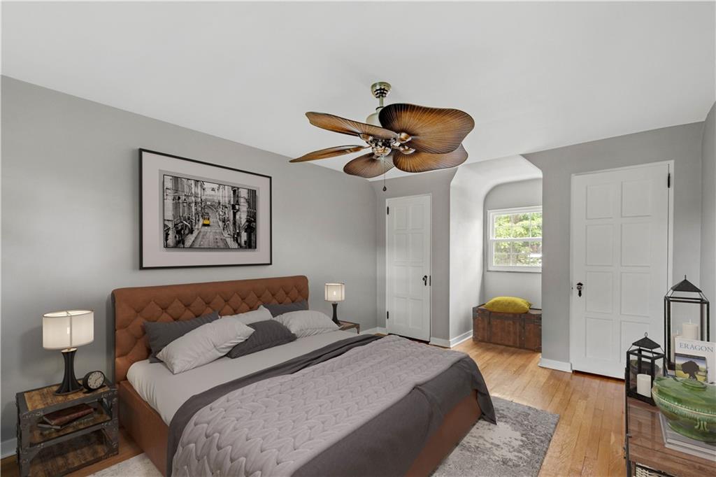 4520 Norwin Road Pittsburgh, PA 15236 - Photo 16 of 31 a bedroom with a bed and a chandelier