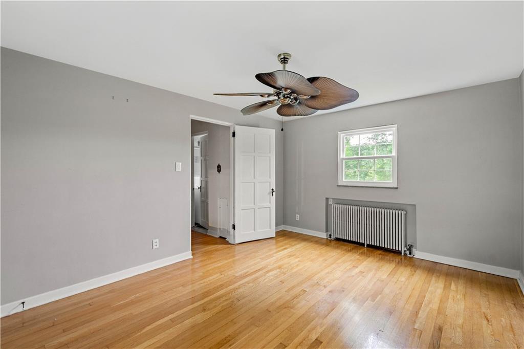 4520 Norwin Road Pittsburgh, PA 15236 - Photo 17 of 31 a view of an empty room with wooden floor and a window