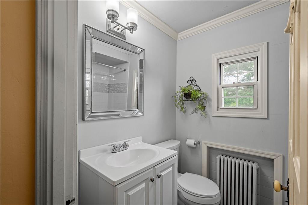4520 Norwin Road Pittsburgh, PA 15236 - Photo 18 of 31 a bathroom with a toilet a sink and mirror