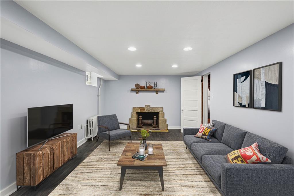 4520 Norwin Road Pittsburgh, PA 15236 - Photo 23 of 31 a living room with furniture and a flat screen tv