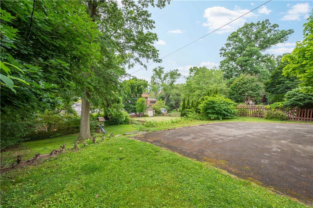 4520 Norwin Road Pittsburgh, PA 15236 - Photo 25 of 31 a view of a yard with plants and large trees