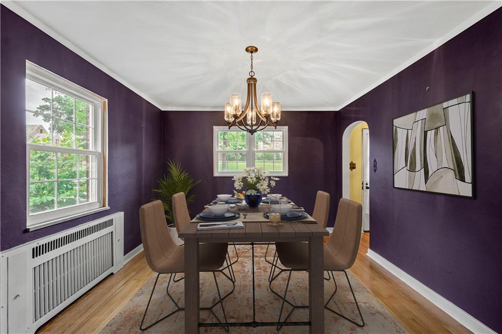 4520 Norwin Road Pittsburgh, PA 15236 - Photo 5 of 31 a dining room with furniture a chandelier and wooden floor