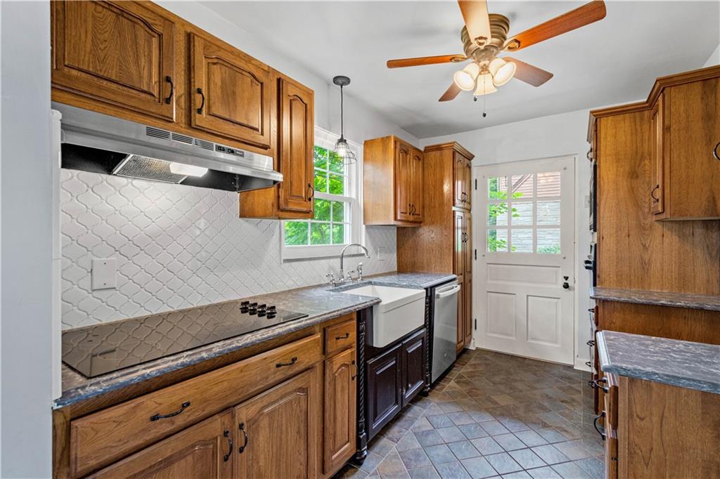 4520 Norwin Road Pittsburgh, PA 15236 - Photo 8 of 31 a kitchen with stainless steel appliances granite countertop a sink a stove cabinets counter space and a window