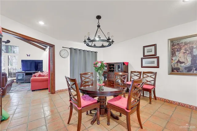 a dining room with furniture and window