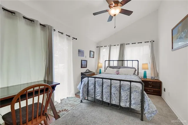 a bedroom with furniture and a window