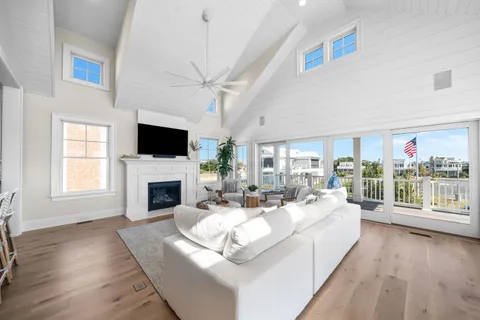 a living room with furniture fireplace and a flat screen tv