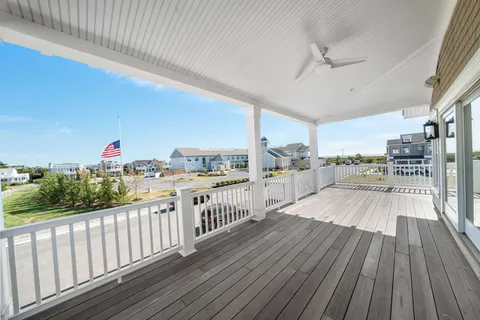 a view of a balcony with wooden floor