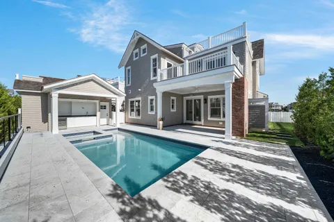 a front view of a house with swimming pool
