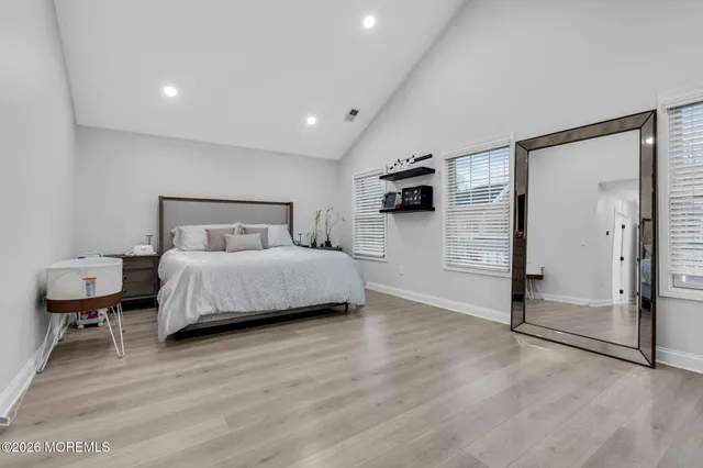 a bedroom with a bed and a view of bathroom