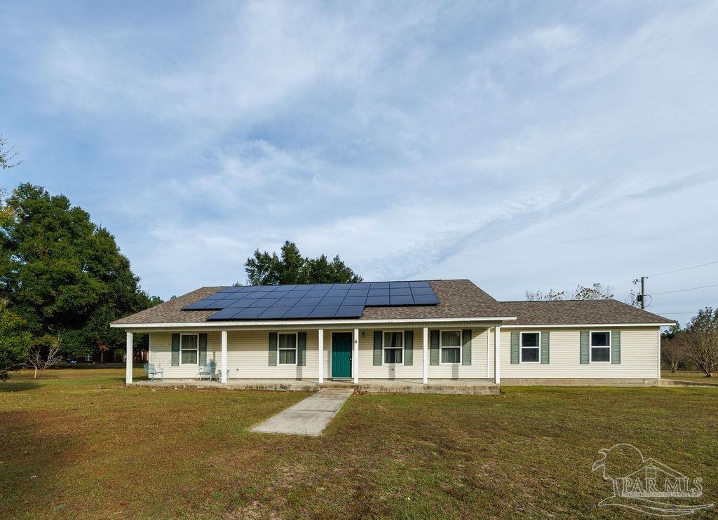 front view of a house with a garden