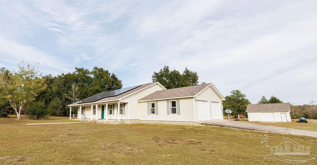 1590 Jacks Branch Road Cantonment, FL 32533 - Photo 19 of 19 a front view of a house with a garden