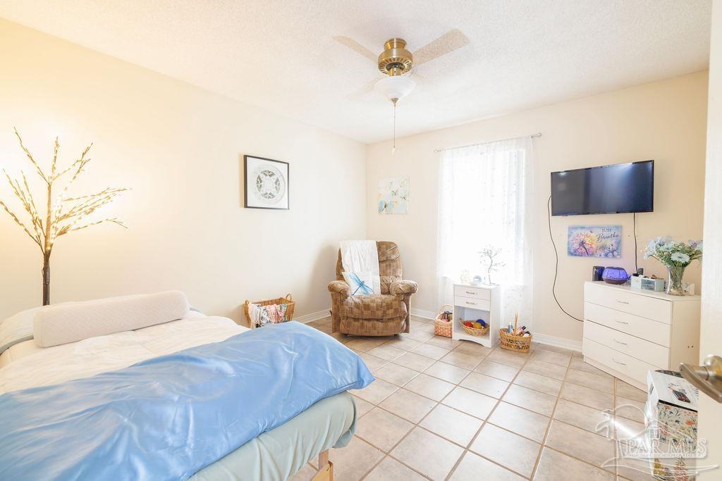 1590 Jacks Branch Road Cantonment, FL 32533 - Photo 3 of 19 a bedroom with a bed and a couch