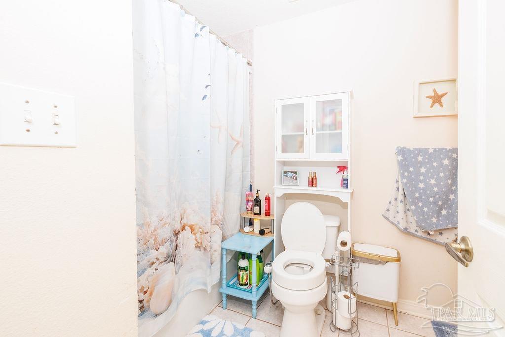 1590 Jacks Branch Road Cantonment, FL 32533 - Photo 4 of 19 a bathroom with a sink toilet and shower