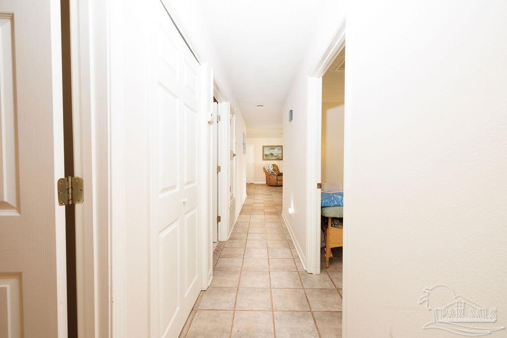1590 Jacks Branch Road Cantonment, FL 32533 - Photo 6 of 19 a view of a hallway with wooden floor