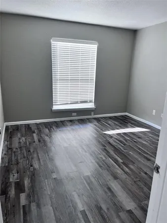 a view of wooden floor in an empty room