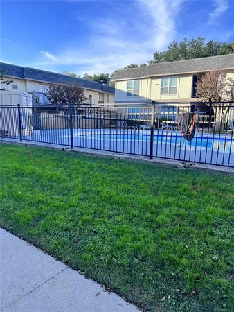 a view of a house with backyard and porch