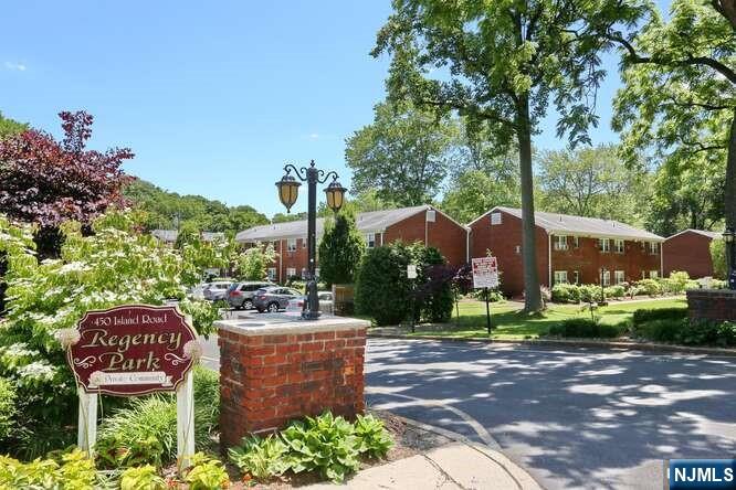 95 Regency Park, Unit 95 Ramsey, NJ 07446 - Photo 11 of 13 a patio with table and chairs
