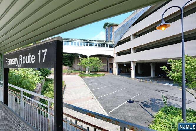 95 Regency Park, Unit 95 Ramsey, NJ 07446 - Photo 12 of 13 a front view of a building with garden