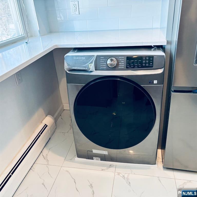 95 Regency Park, Unit 95 Ramsey, NJ 07446 - Photo 6 of 13 a utility room with a washer and dryer