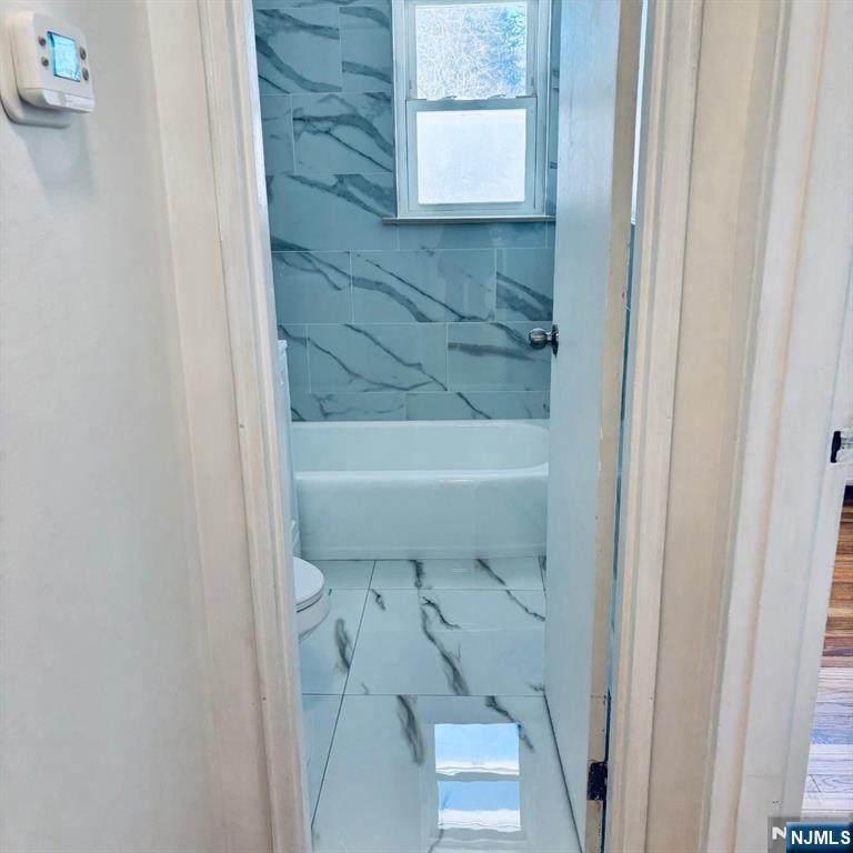 95 Regency Park, Unit 95 Ramsey, NJ 07446 - Photo 9 of 13 a bathroom with a sink and toilet