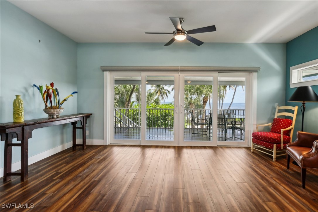 8335 Main Street Bokeelia, FL 33922 - Photo 19 of 47 a living room with furniture and a wooden floor