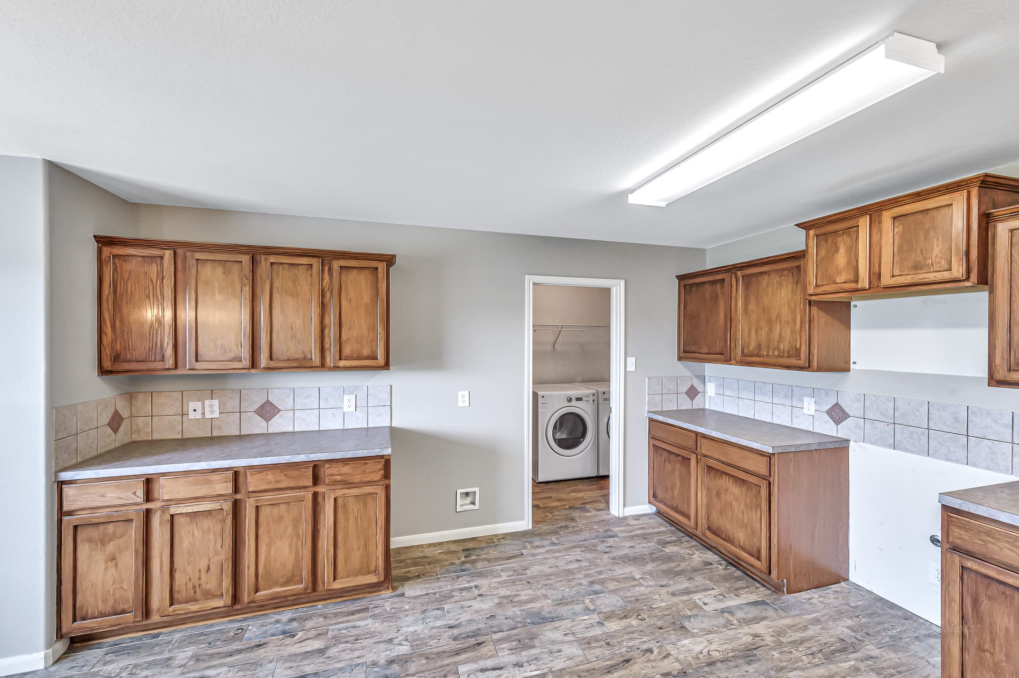 20243 Sunset Ranch Drive Katy, TX 77449 - Photo 13 of 36 a kitchen with a stove a sink and a refrigerator