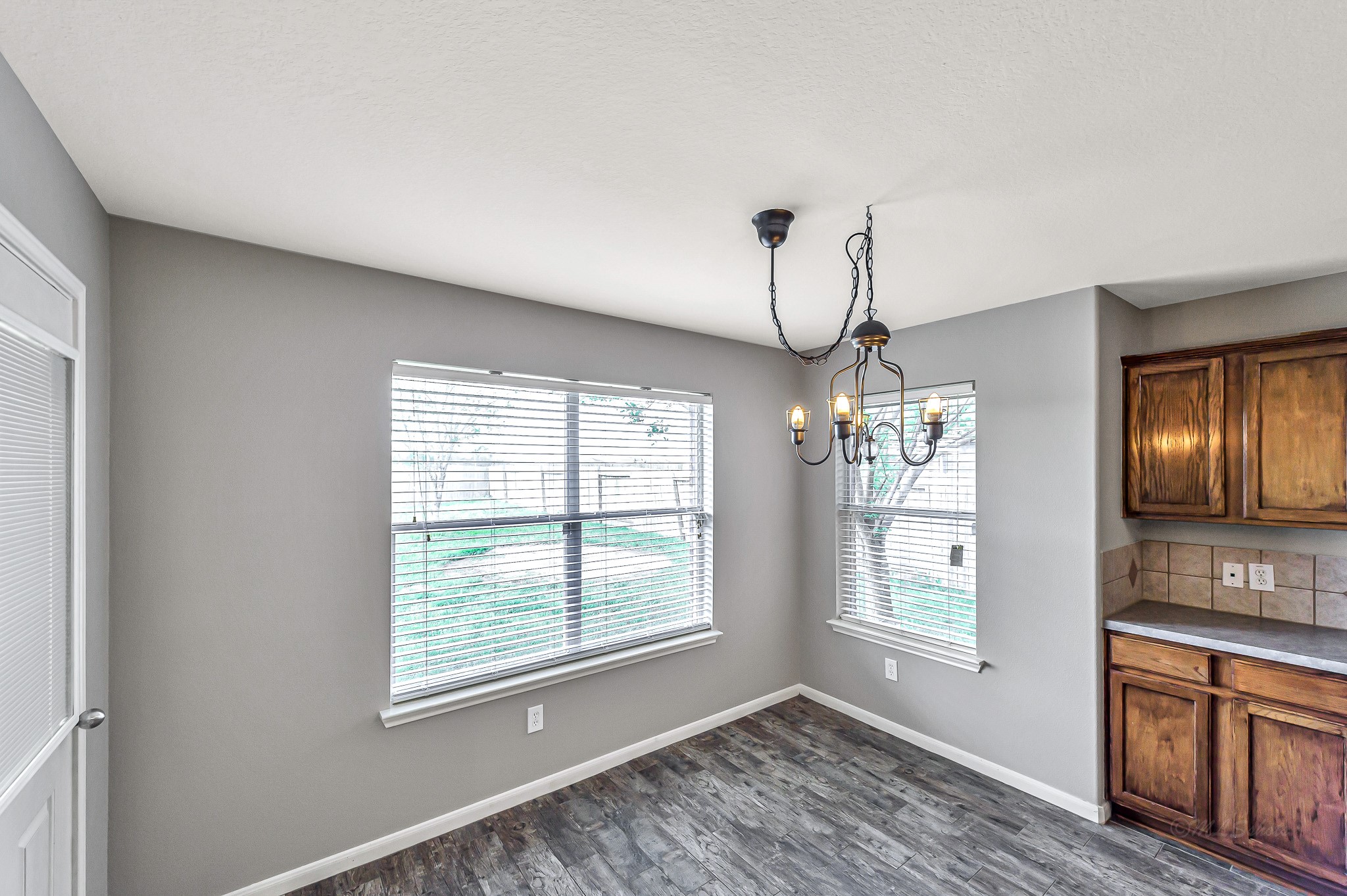 20243 Sunset Ranch Drive Katy, TX 77449 - Photo 16 of 36 a view of an empty room with window and cabinet