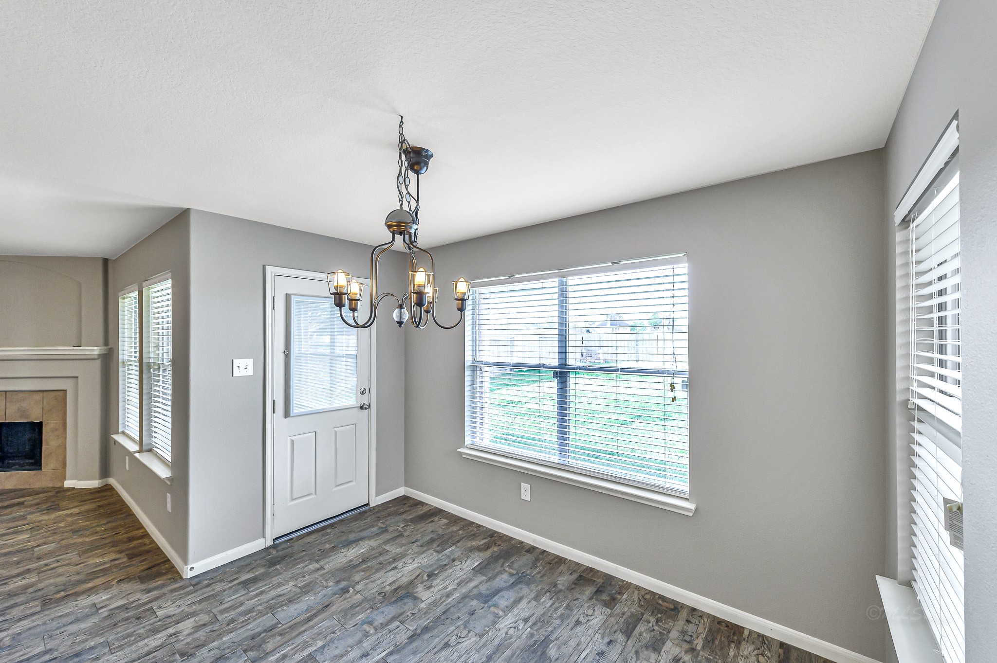 20243 Sunset Ranch Drive Katy, TX 77449 - Photo 17 of 36 a view of an empty room with wooden floor and a window