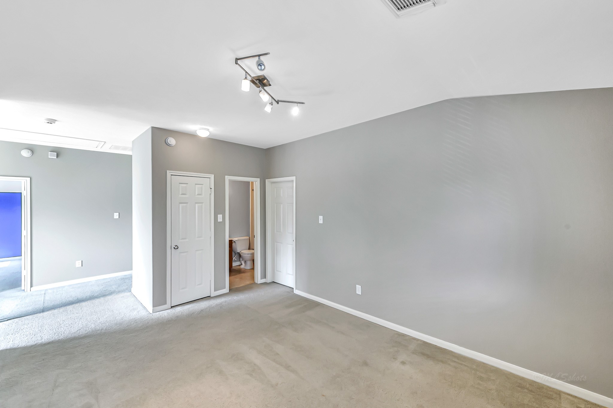 20243 Sunset Ranch Drive Katy, TX 77449 - Photo 21 of 36 a view of an empty room with a chandelier fan