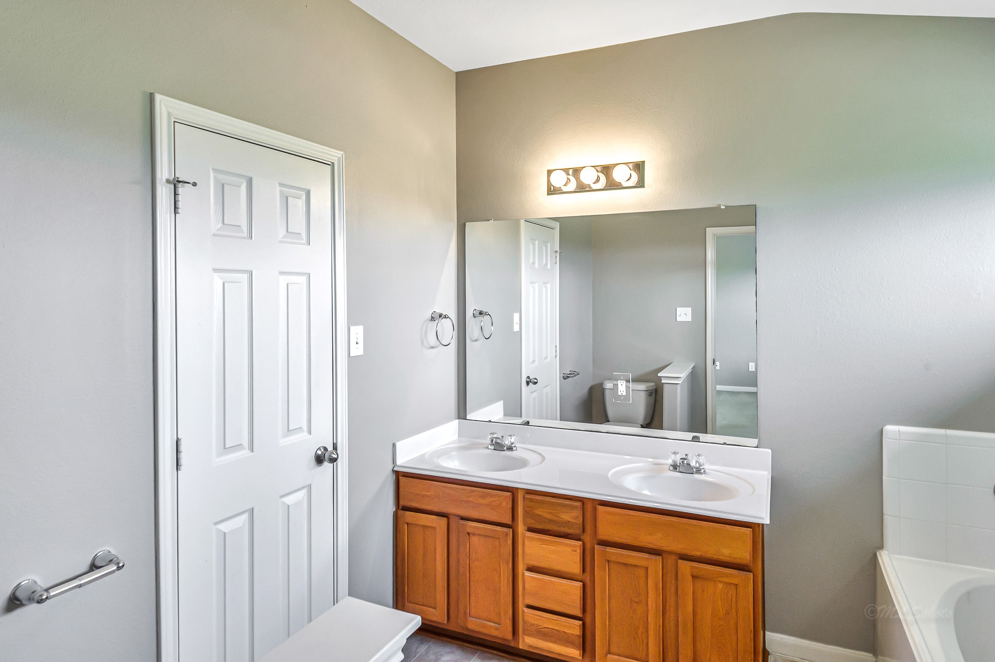 20243 Sunset Ranch Drive Katy, TX 77449 - Photo 24 of 36 a bathroom with a sink a toilet and a mirror