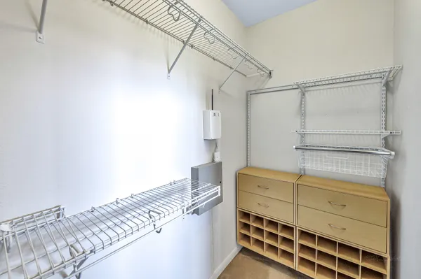 a bedroom with a bed and a cabinets