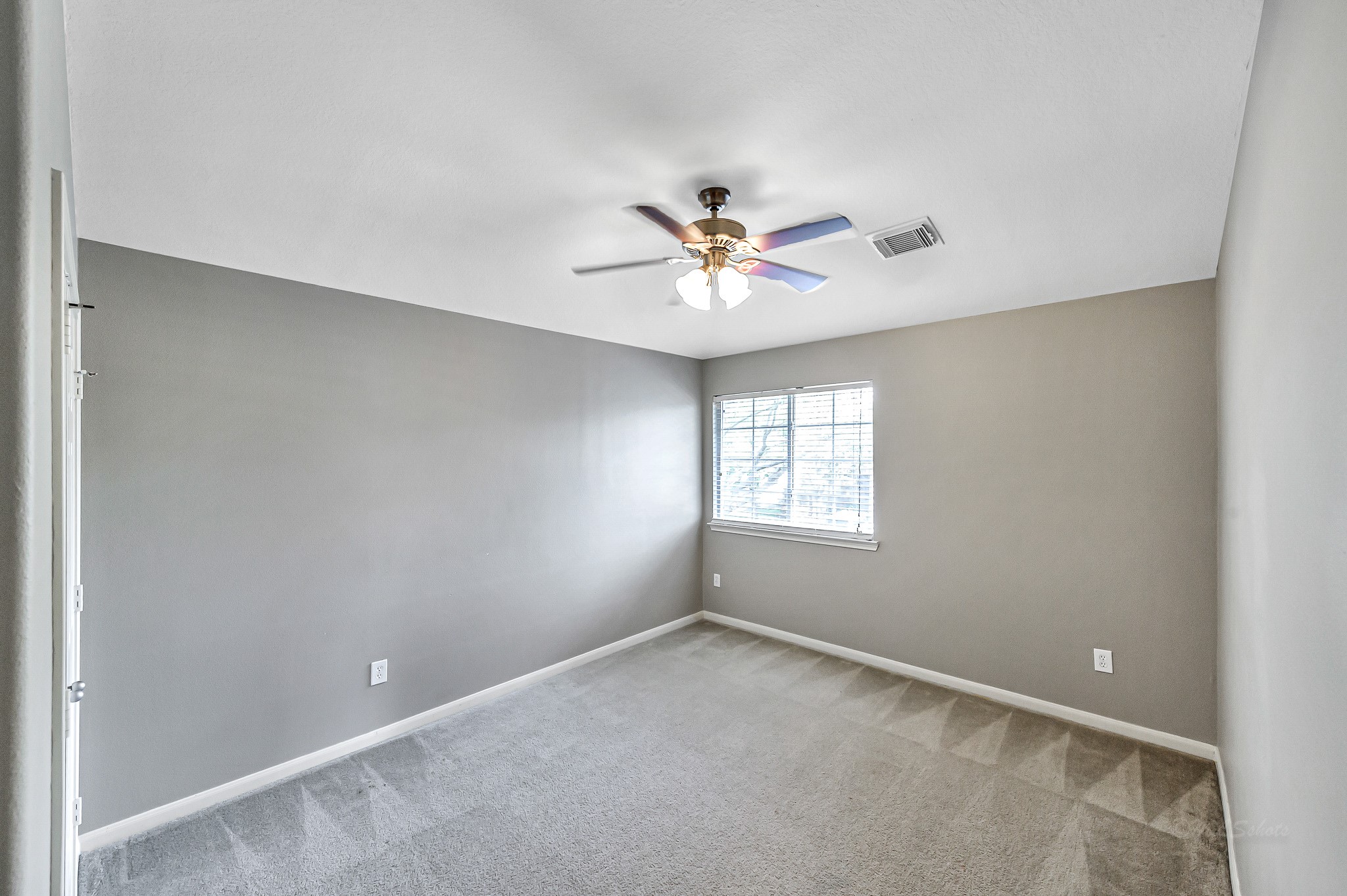 20243 Sunset Ranch Drive Katy, TX 77449 - Photo 28 of 36 an empty room with a window and a fan