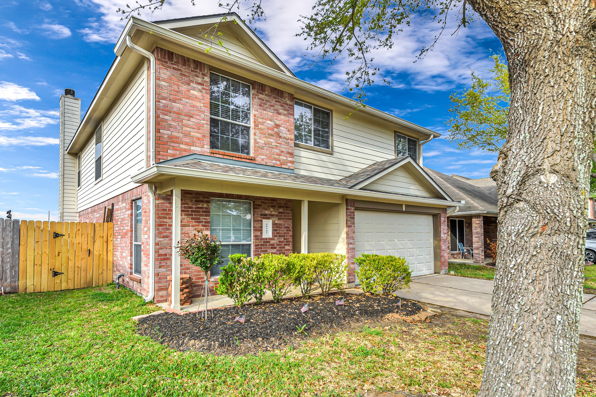 20243 Sunset Ranch Drive Katy, TX 77449 - Photo 3 of 36 a front view of a house with garden