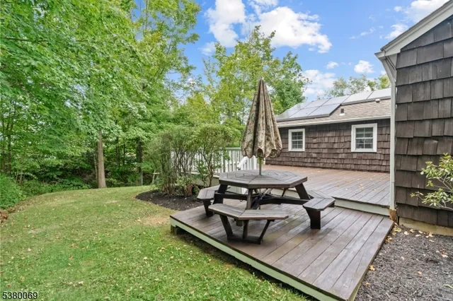 a view of a backyard with sitting area