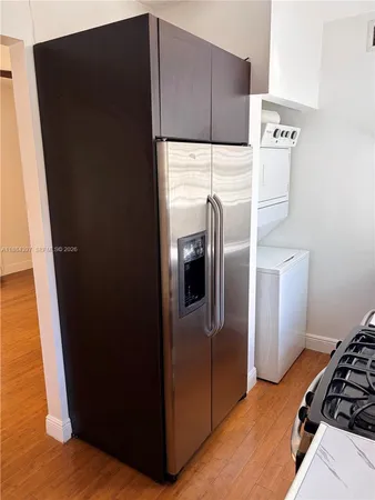 a kitchen with a refrigerator and a refrigerator