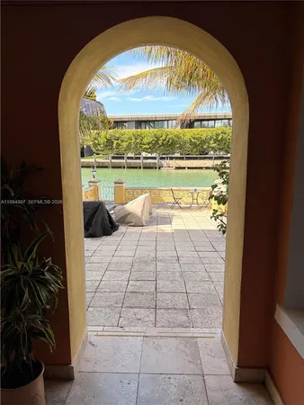a view of a lake with a table and chairs