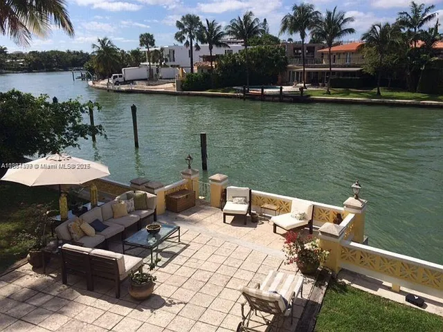 a view of a lake with outdoor seating