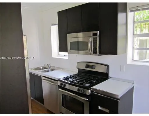 a kitchen with a stove and a microwave