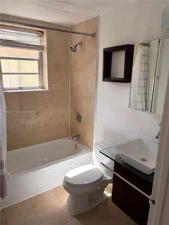 a bathroom with a sink a toilet and a bathtub