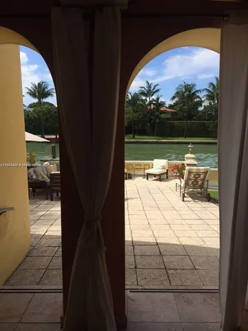 a view of swimming pool from a balcony