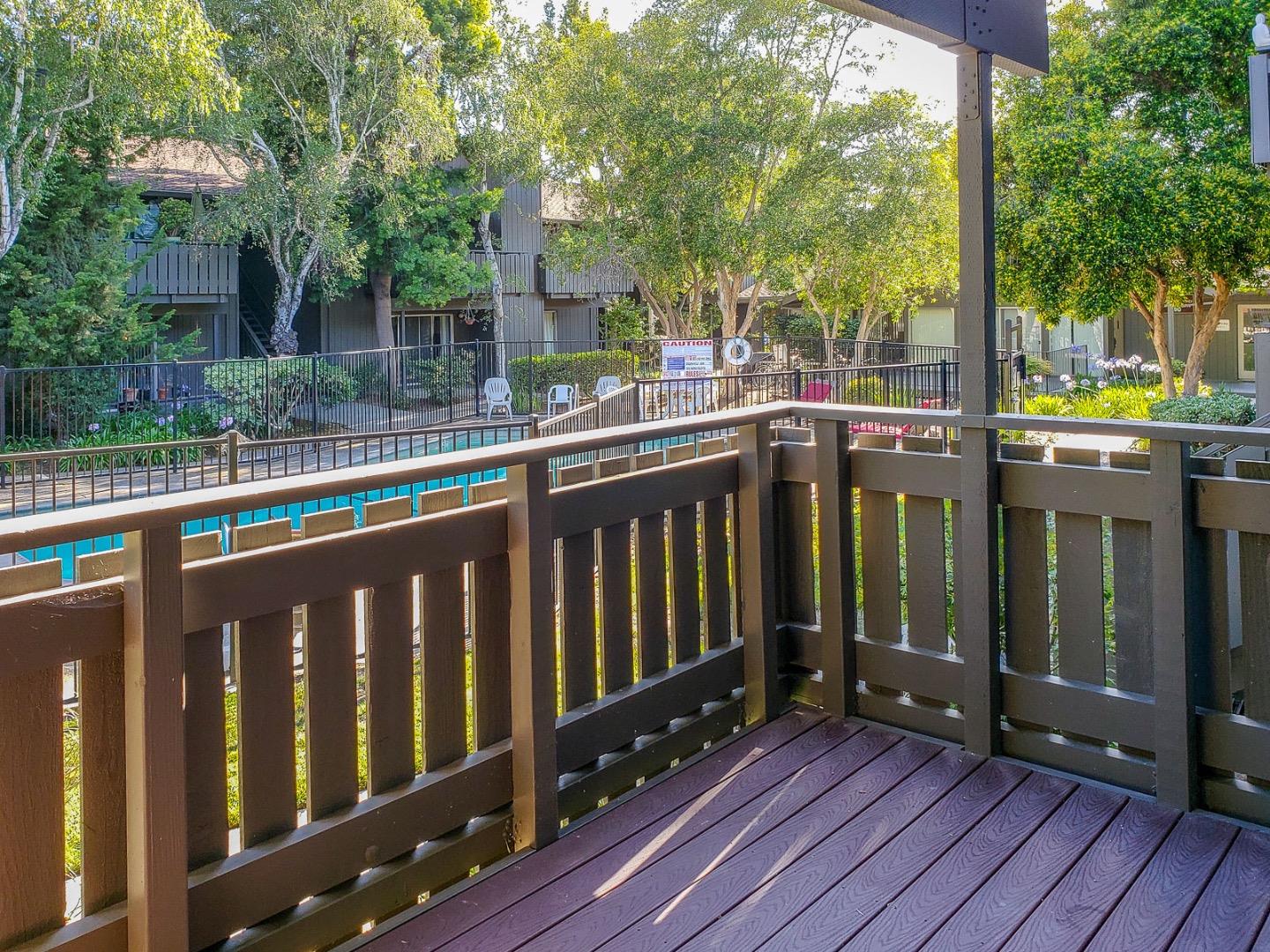 50 East Middlefield Road, Unit 4 Mountain View, CA 94043 - Photo 11 of 12 a view of a deck with wooden floor and fence