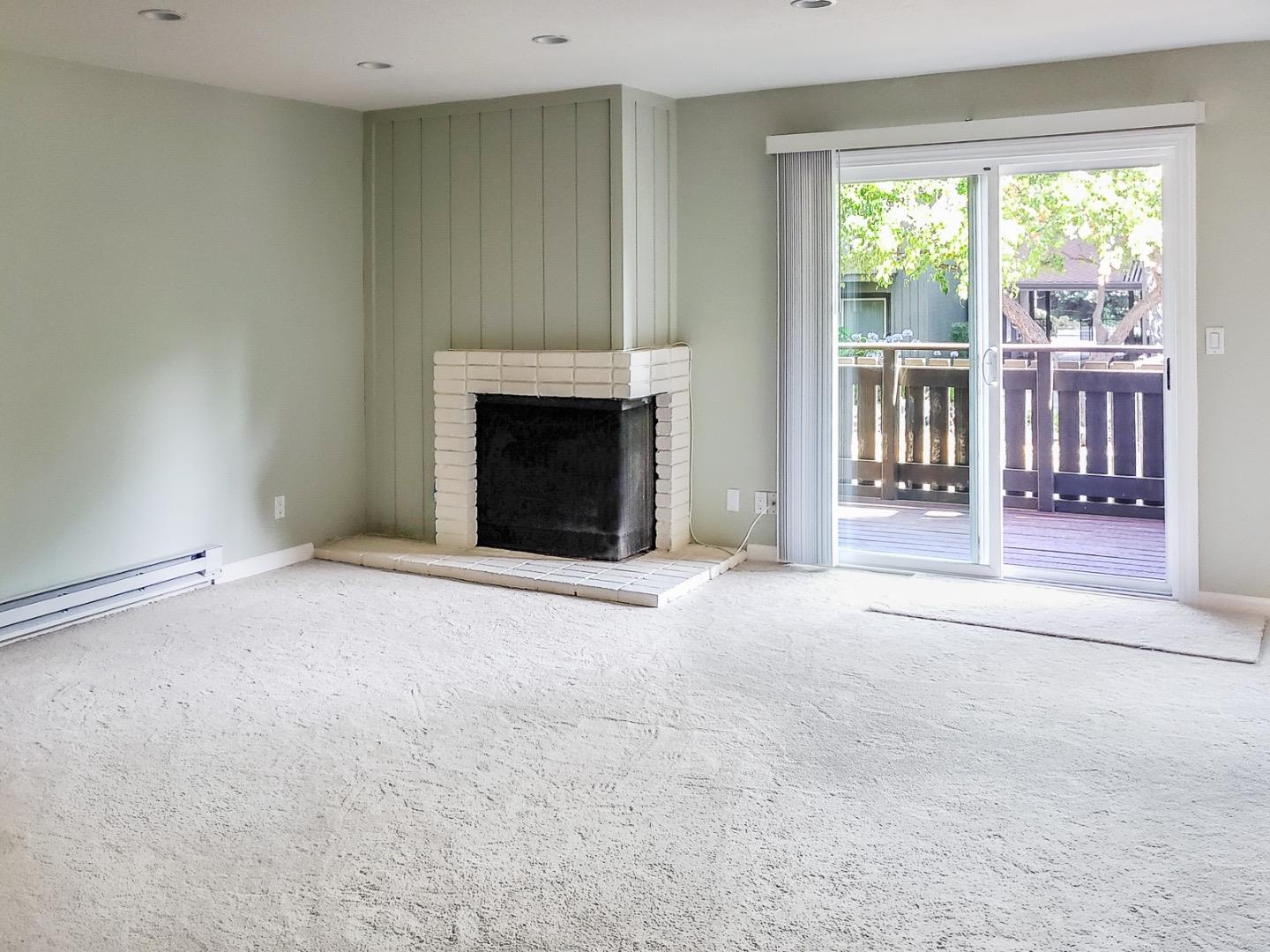 50 East Middlefield Road, Unit 4 Mountain View, CA 94043 - Photo 2 of 12 a view of an empty room with a fireplace