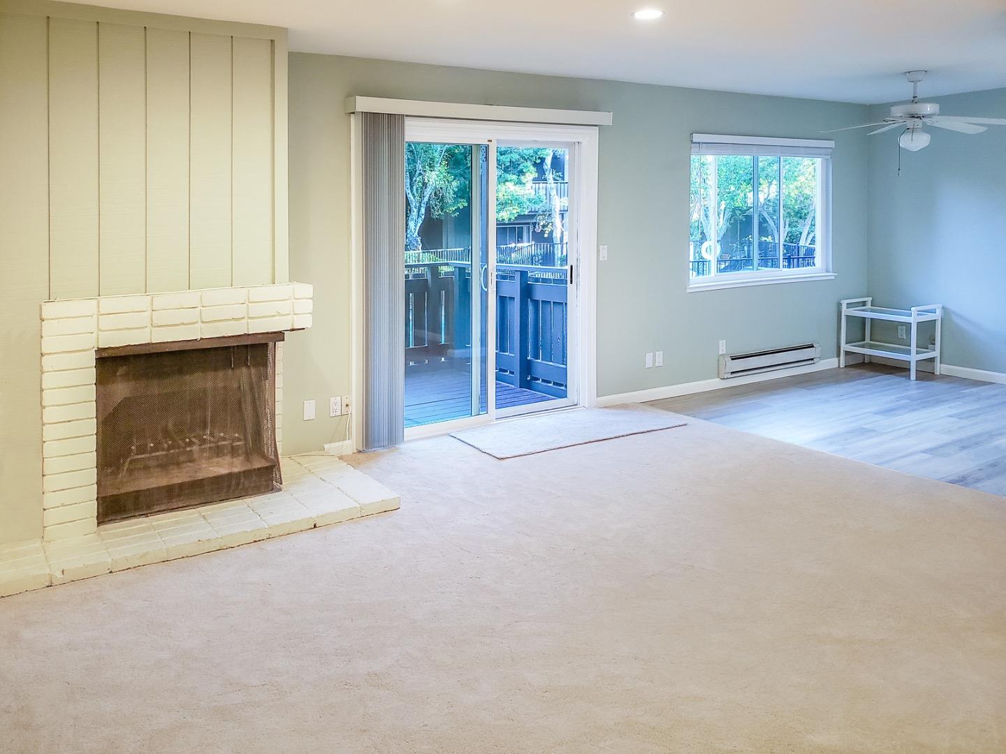 50 East Middlefield Road, Unit 4 Mountain View, CA 94043 - Photo 4 of 12 a view of an empty room with window and fireplace