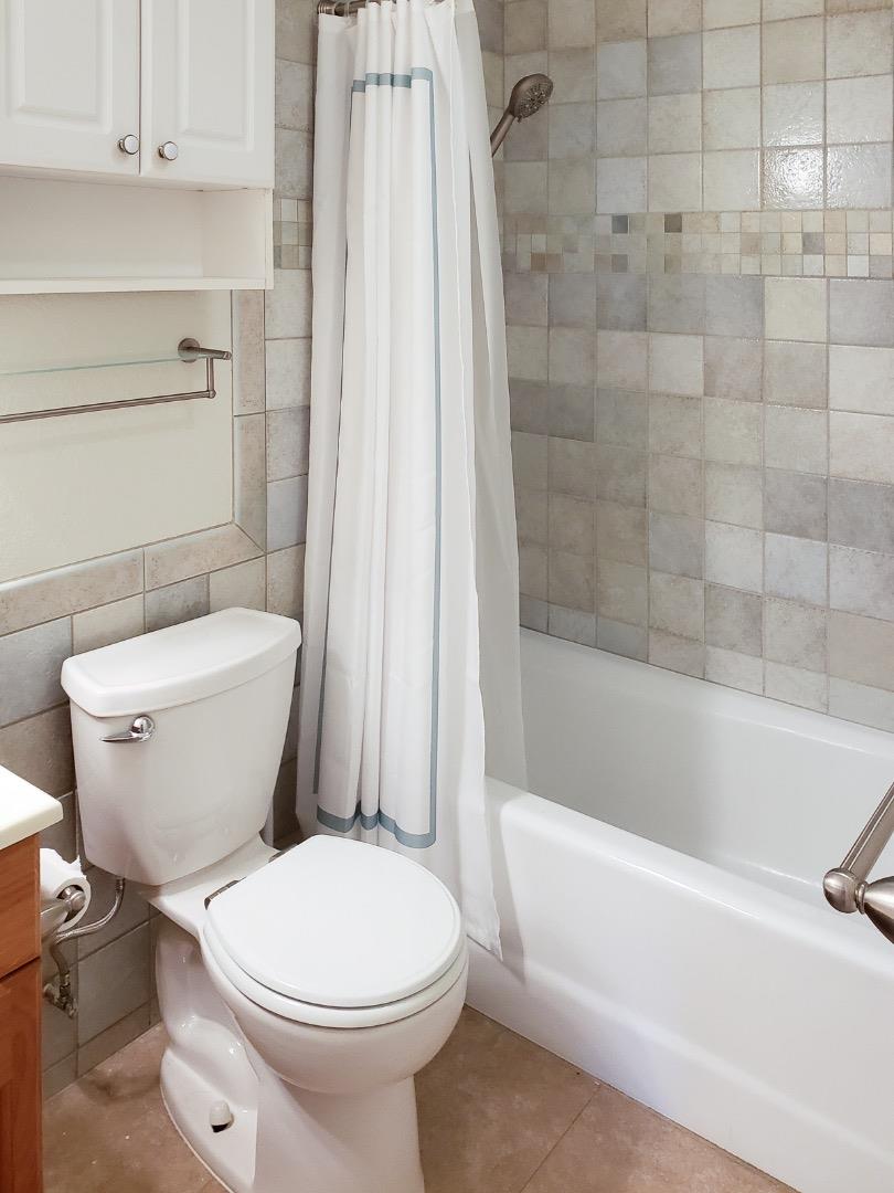 50 East Middlefield Road, Unit 4 Mountain View, CA 94043 - Photo 9 of 12 a white toilet sitting next to a bath tub