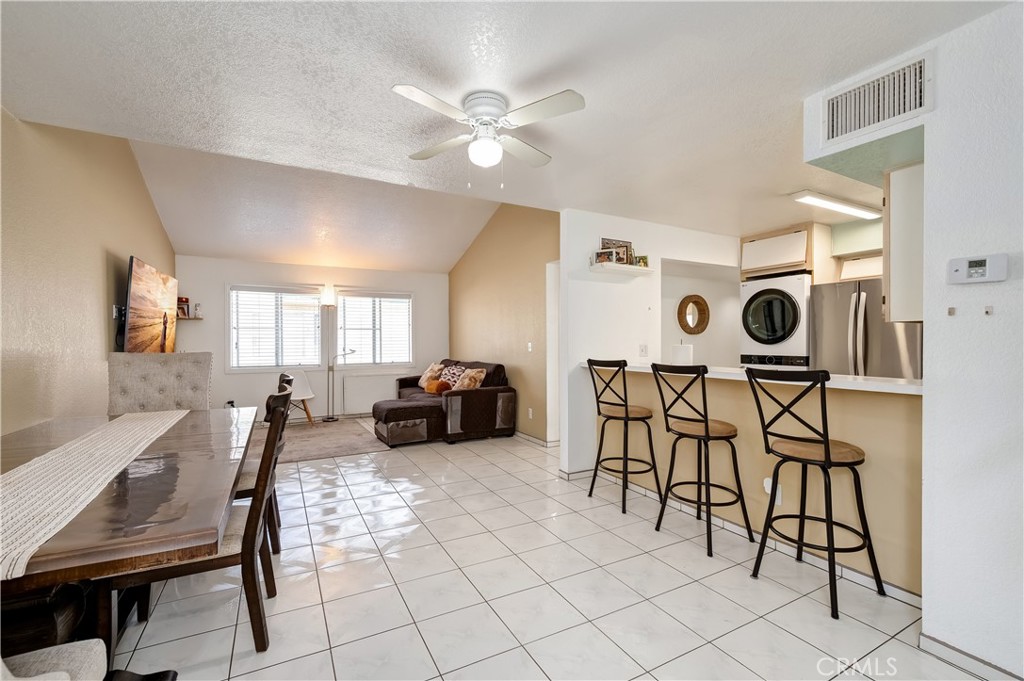 15000 Downey Avenue, Unit 343 Paramount, CA 90723 - Photo 16 of 39 a view of a dining room with furniture and a chandelier