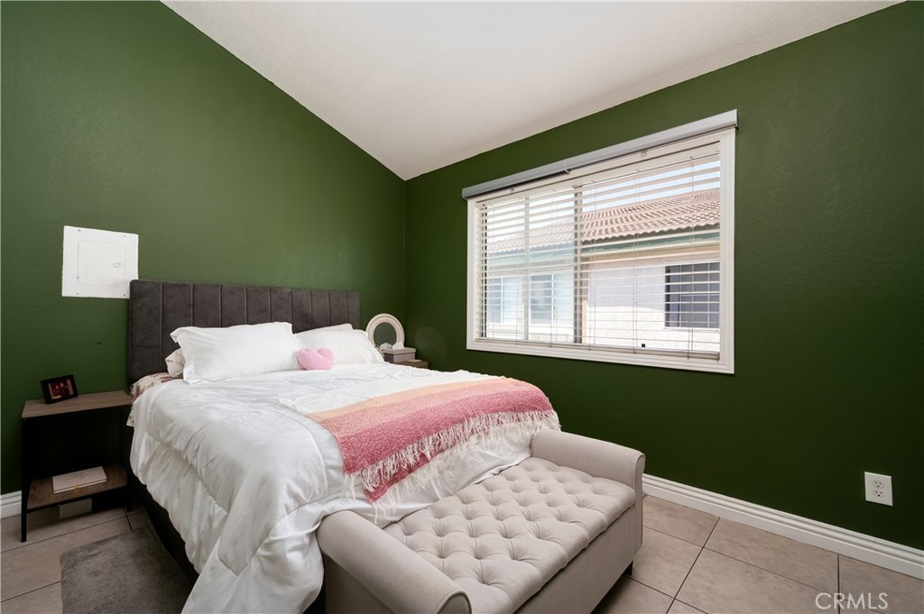 15000 Downey Avenue, Unit 343 Paramount, CA 90723 - Photo 22 of 39 a bedroom with a bed and window