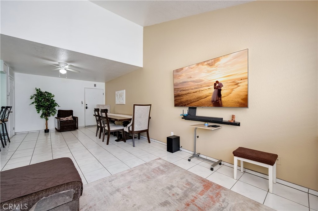 15000 Downey Avenue, Unit 343 Paramount, CA 90723 - Photo 7 of 39 a living room with furniture and a flat screen tv
