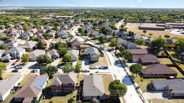 an aerial view of residential houses with outdoor space