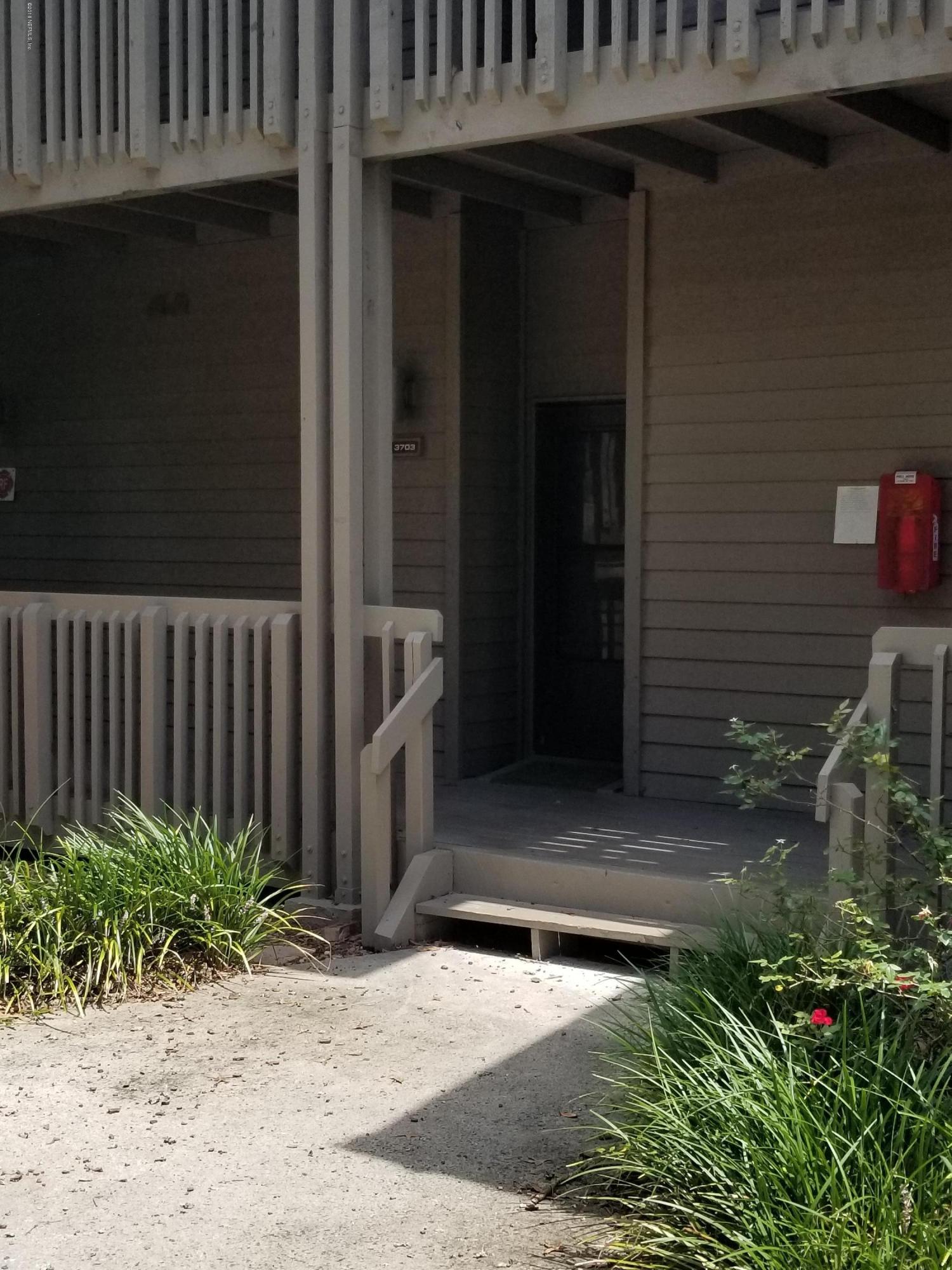 3175 Ravines Road, Unit 3703 Middleburg, FL 32068 - Photo 1 of 13 a couple of potted plants in front of door