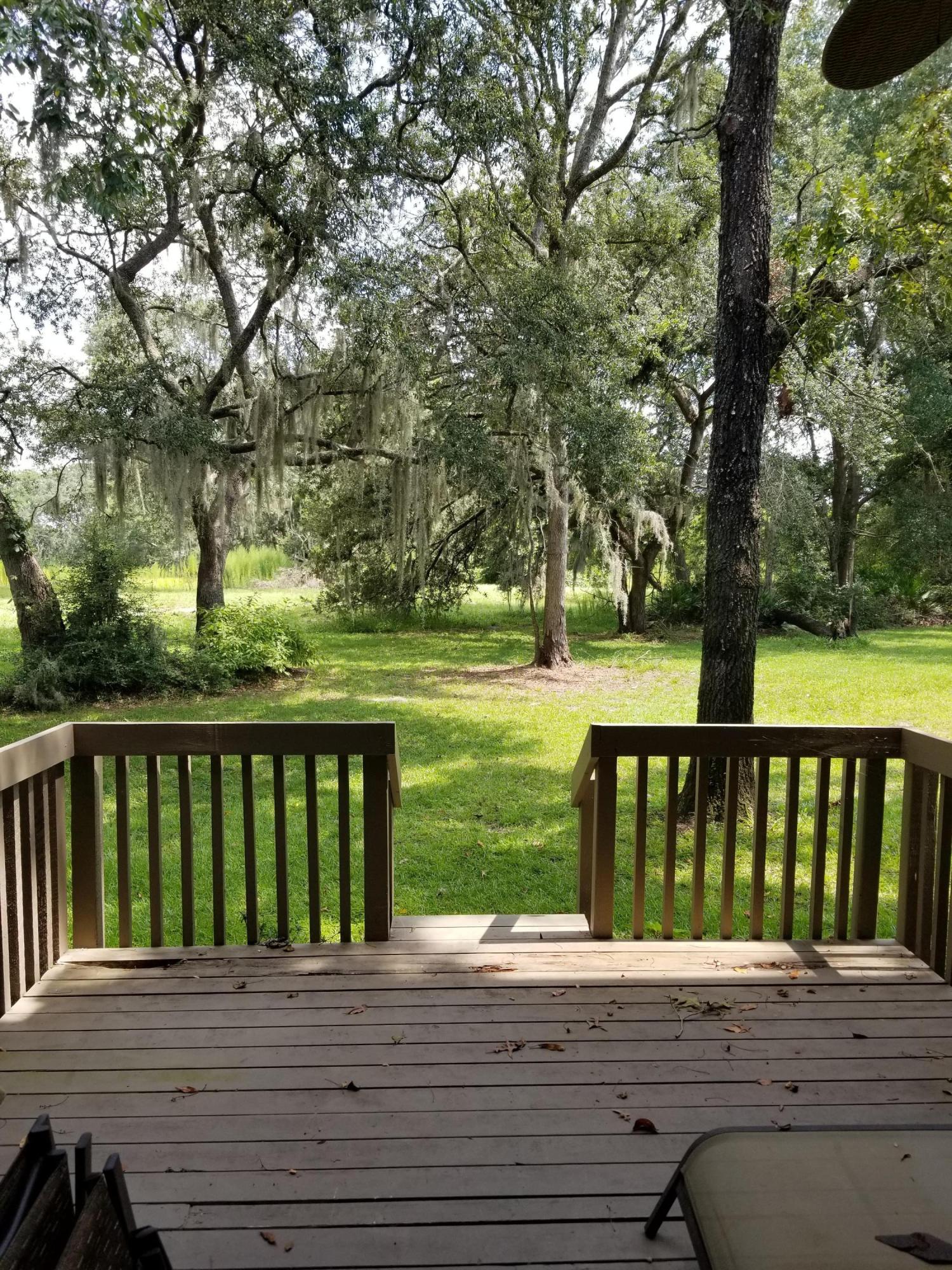 3175 Ravines Road, Unit 3703 Middleburg, FL 32068 - Photo 12 of 13 a view of wooden deck and a garden
